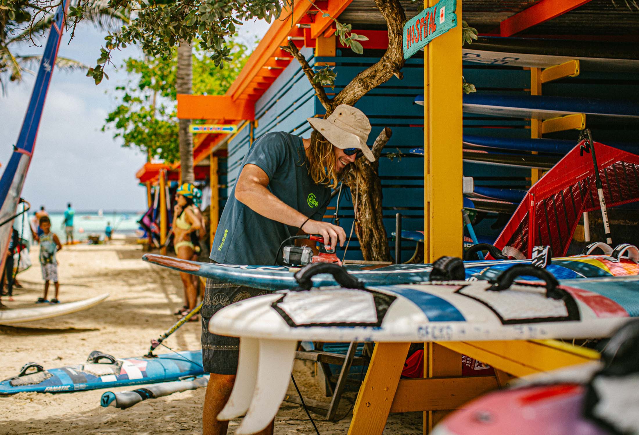Man waxing a surfboard