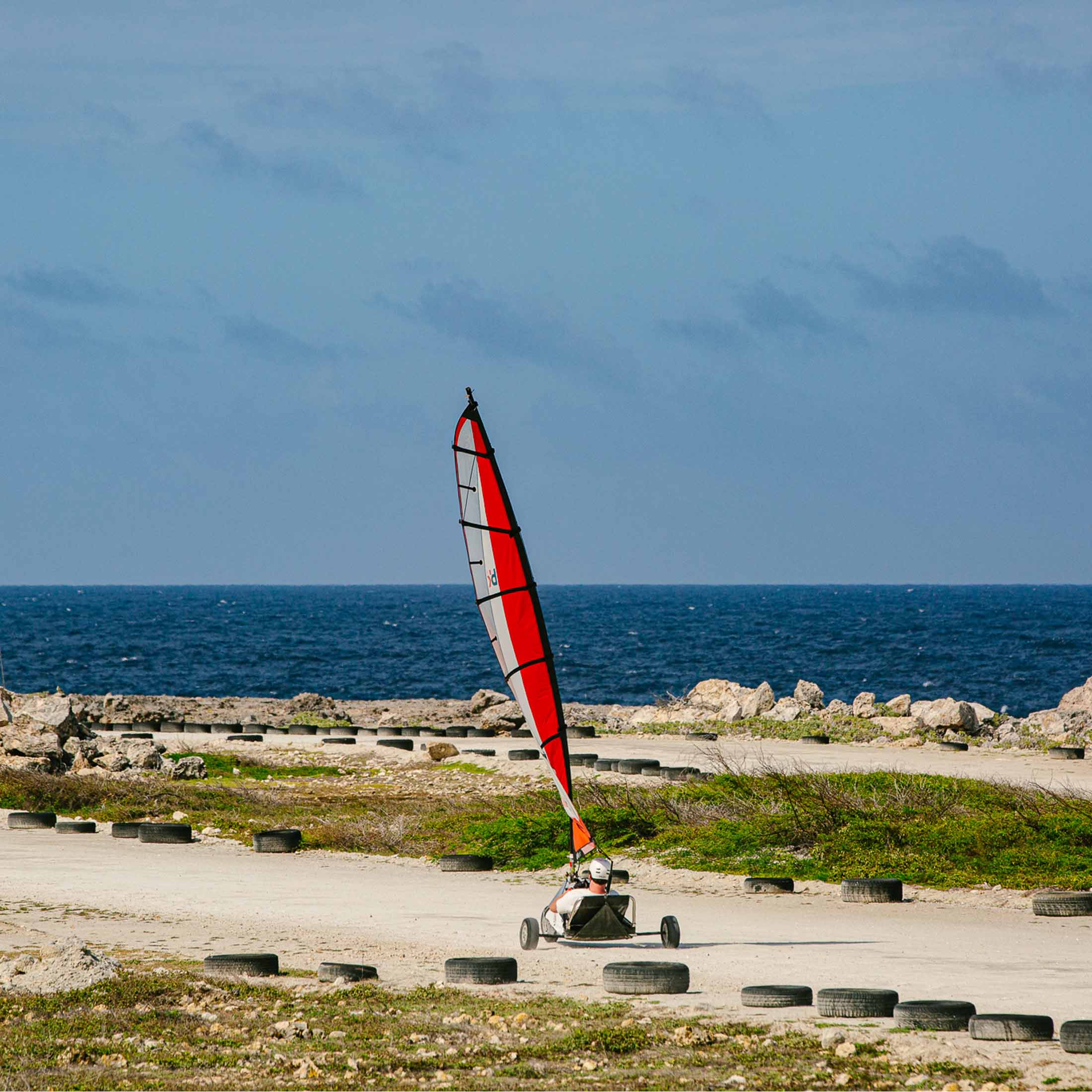 Person in land sailing vehicle