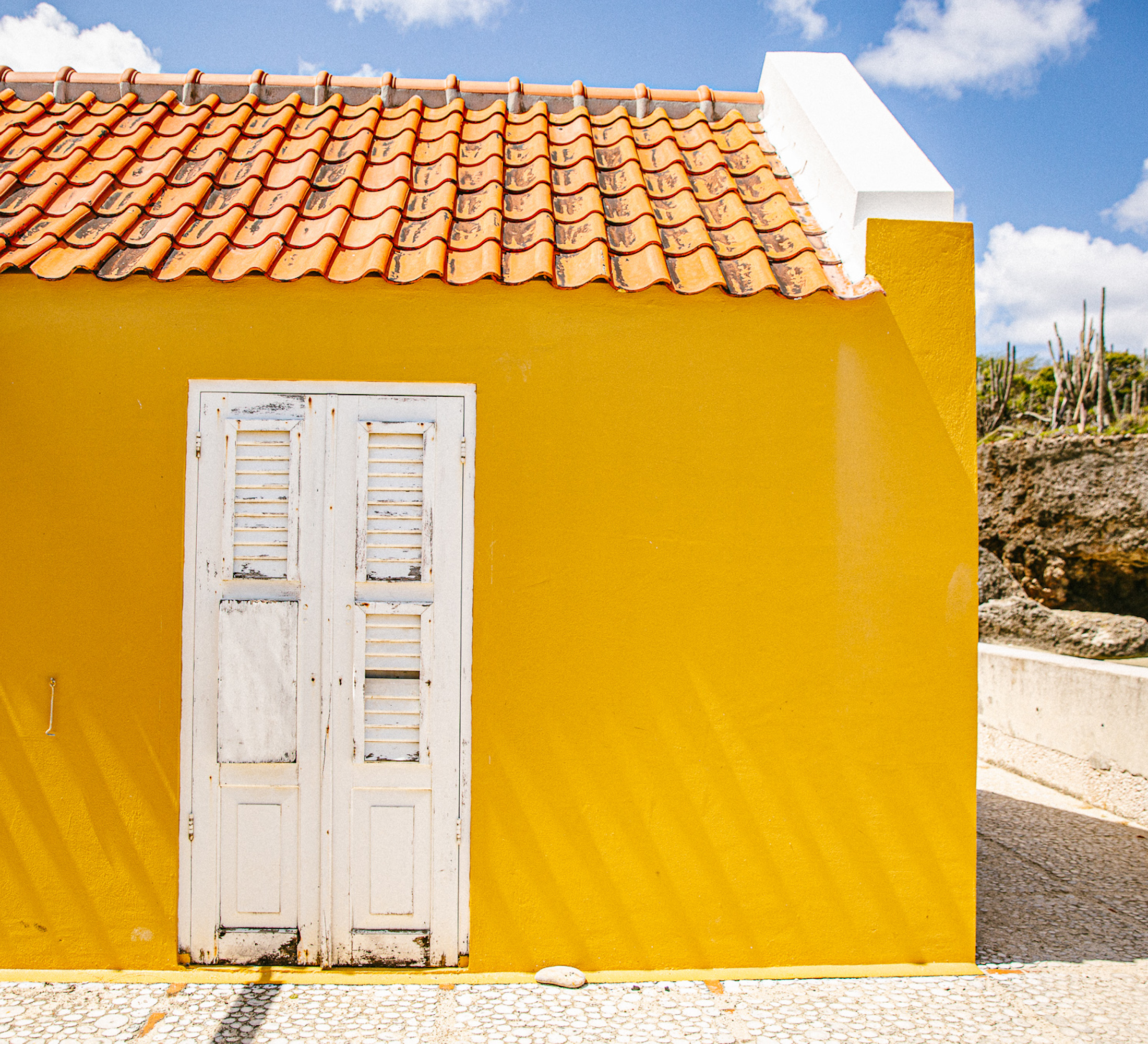 White doorway on yellow building