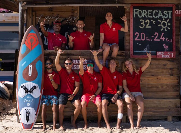 Group of employees posing in front of business