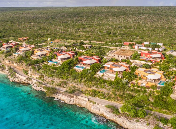 Aerial view of apartment property by the ocean