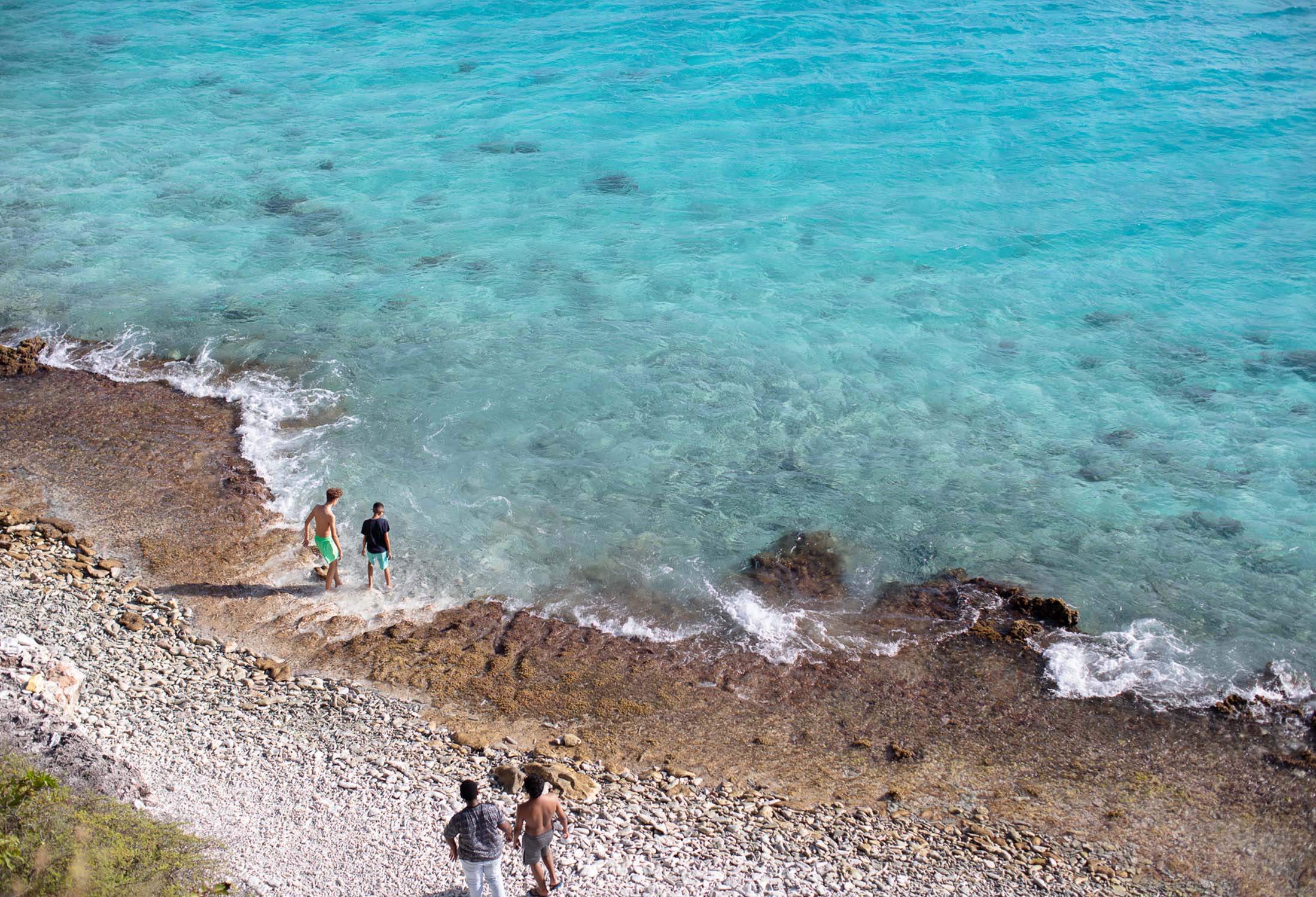 Crystal clear water washing up on the beach