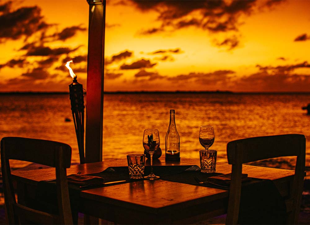 Table setting with wine at sunset