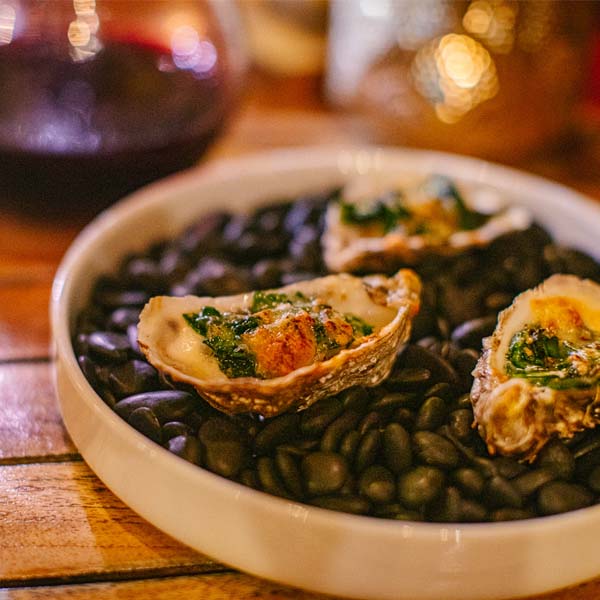 Bowl of oysters on table