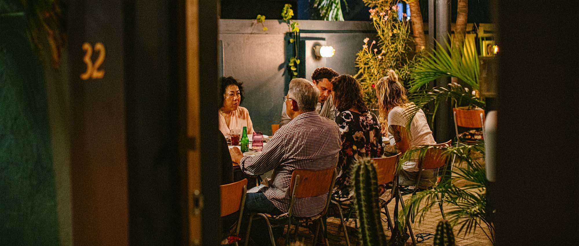 Diverse group sitting at dinner table