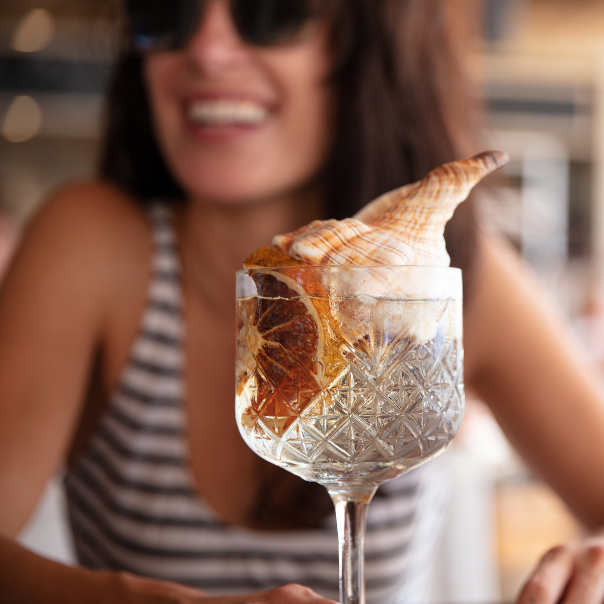 Woman enjoying dinner cocktail