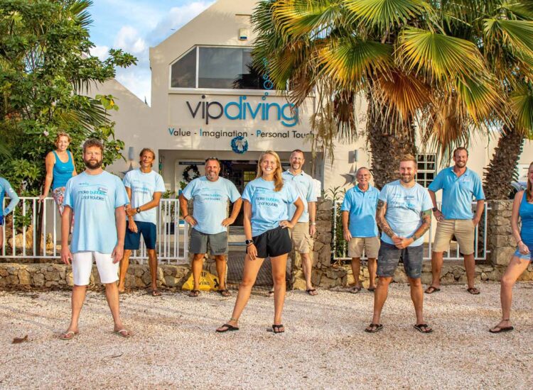 Group of employees lined up in front of the building exterior