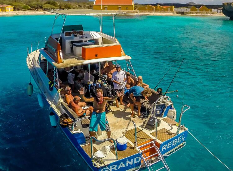 Aerial shot of multiple people aboard a boat in the ocean